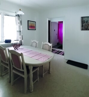 Enjoy meals with friends and family in this cozy dining area, featuring a round table and four chairs.
