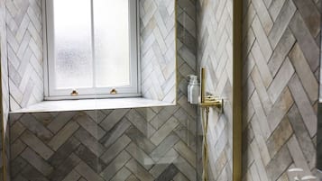 Shower, eco-friendly toiletries, hair dryer, towels
