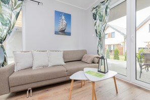 Apartment, 1 Schlafzimmer, Terrasse, Meerseite | Wohnzimmer