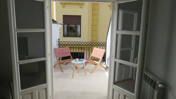 Superior Apartment | Living area | 50-inch Smart TV with digital channels