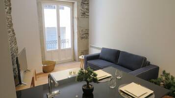 Comfort Apartment | Living area | 50-inch Smart TV with digital channels