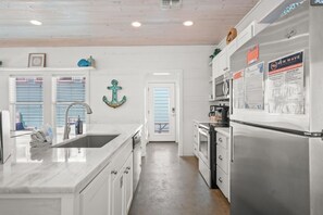 Fridge, microwave, oven, stovetop - `Retreat to Barefoot Bungalow: A Luxurious Getaway in a Tranquil Gated Island Community` (Port Aransas)