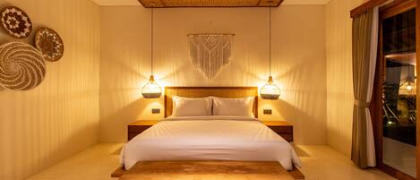 A well-lit bedroom with a large bed, two bedside lamps, and a woven ceiling.