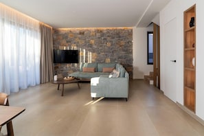 Luxury Villa | Living area | 55-inch Smart TV with satellite channels, fireplace - Canvas Villas By the Sea (Malevizi)