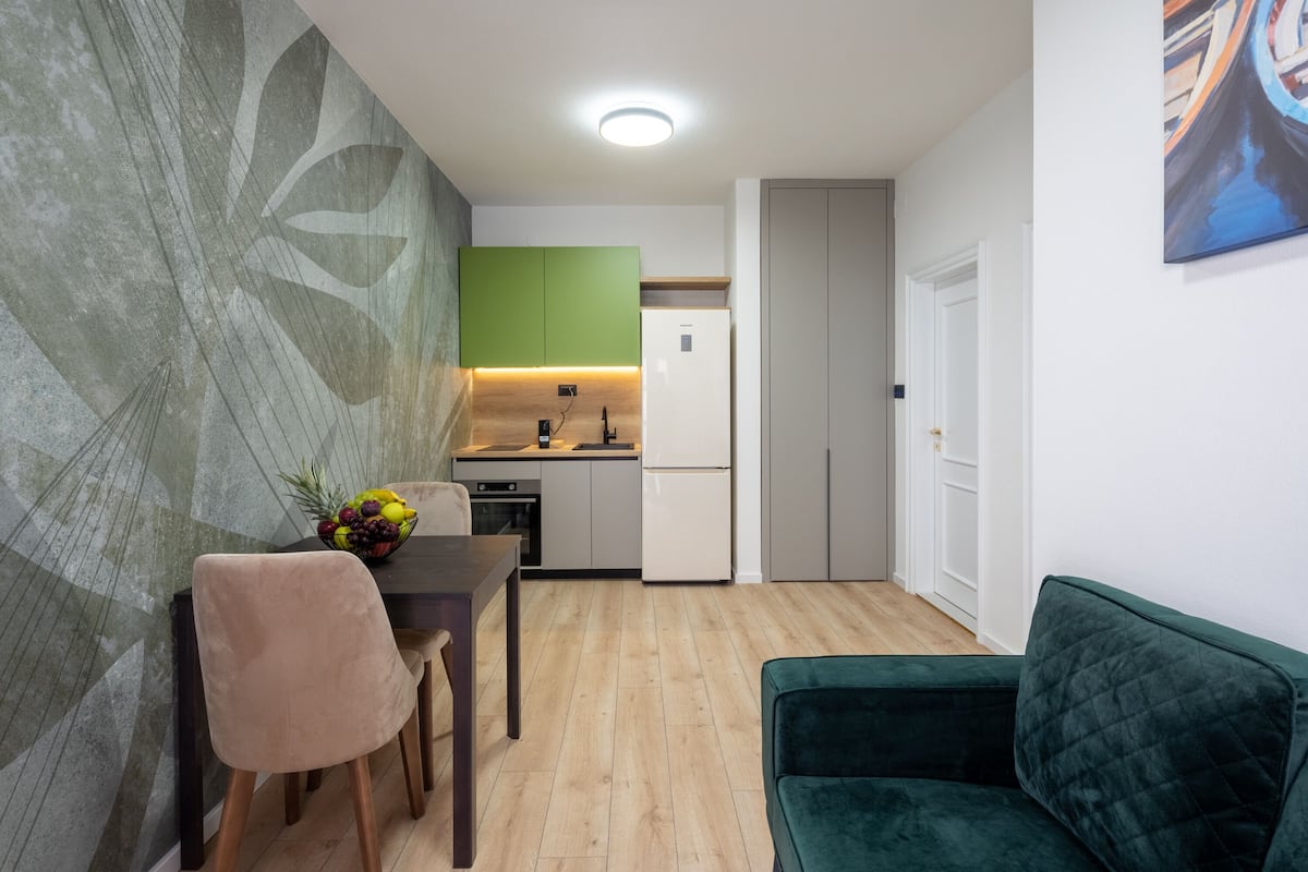 Standard Apartment | Living area | 43-inch flat-screen TV with cable channels