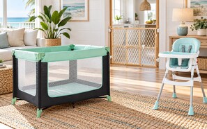 A baby playpen with a mesh top and a high chair with a tray.