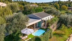 A modern villa with a swimming pool, surrounded by lush greenery and olive trees. - Villa Oras Corfu Dionisos by Villa Plus (Ionian Islands)