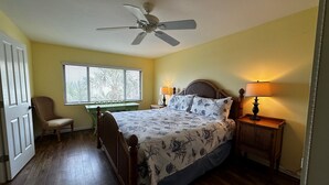 A bedroom with a bed, a chair, a desk, a ceiling fan, and a window with blinds. - Gorgeous Gulf views from this 2bd/2 bath condo (Sarasota)