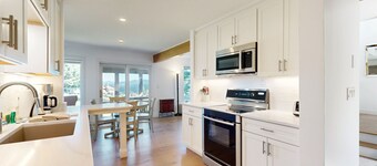 Tranquil lakeside retreat with beach access, pool, firepit, & lovely patio views