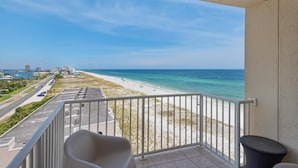 A balcony with a view of a beach and ocean. - Sans Souci Unit 601 (Pensacola Beach)