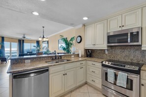 Apartment, Multiple Beds (Emerald Isle unit 202) | Private kitchen | Oven, toaster, paper towels - Emerald Isle Unit 202 (Pensacola Beach)