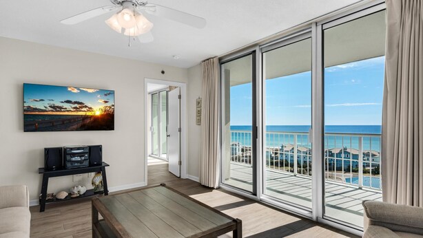 A spacious balcony with a view of the ocean and a sunset. - Tristan Towers Unit 9B (Pensacola Beach)