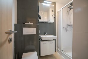 Regadera y secadora de cabello 