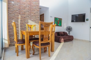 Deluxe Apartment | Living area | TV - Atardecer by Olamar Living (Coveñas)