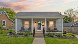 A two-story house with a front porch, a front door, and a mailbox. - Welcome Home! 10 mins to the Horse Park, Bourbon Trail & We're Pet Friendly (Georgetown)