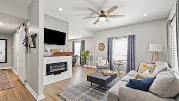 Smart TV, fireplace, books, printers