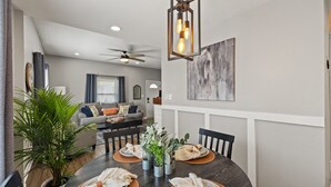 A dining area with a round table, chairs, and a ceiling fan. - Welcome Home! 10 mins to the Horse Park, Bourbon Trail & We're Pet Friendly (Georgetown)