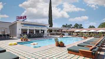 Outdoor pool, open 9:00 AM to 10:00 PM, pool umbrellas, pool loungers