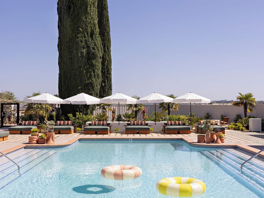 Outdoor pool, open 9:00 AM to 10:00 PM, free cabanas, pool umbrellas