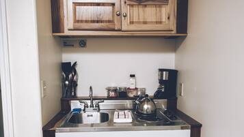 Fridge, stovetop, coffee/tea maker, cookware/dishes/utensils