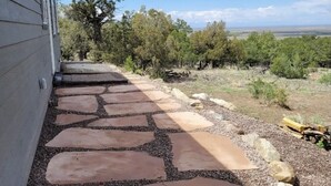 A stone pathway leading to a house with a view of a tree and open landscape. - Mountain Side Home with Spectacular Views!! 2bd-2ba - 420 & Dog Friendly + AC !! (Crestone)