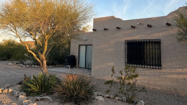 A modern building with a flat roof, a large window, and a door. - 2 Bdr 1 Bath Mountain View House (Tucson)