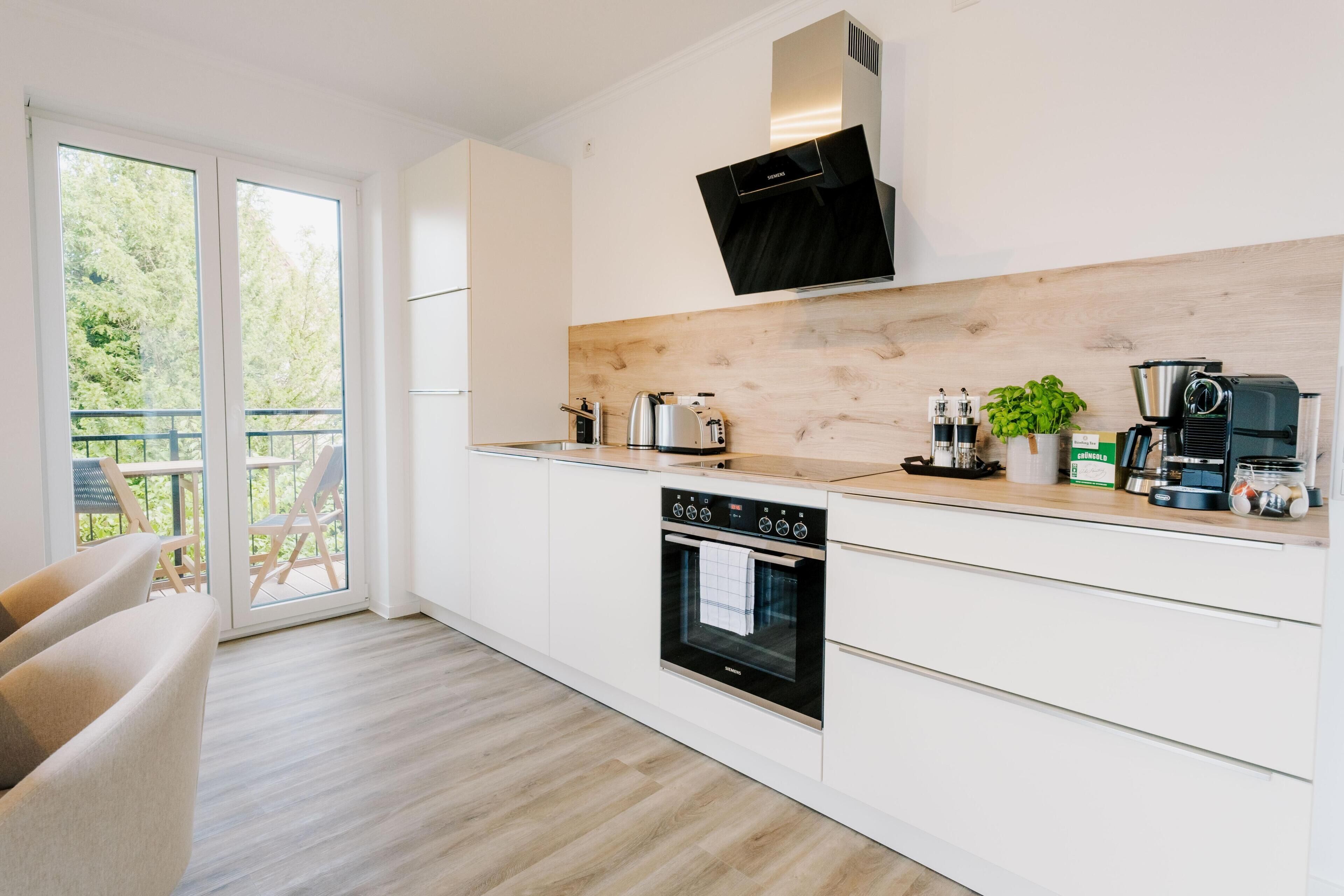 Coffee/tea maker, fridge, microwave, oven