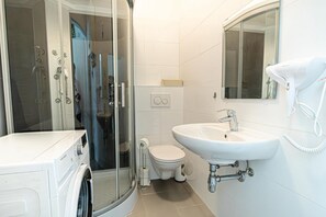 Hair dryer, towels, soap, shampoo