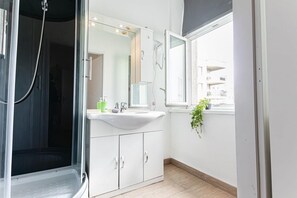 Shower, hair dryer, towels, soap