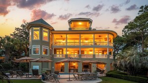 A multi-story building with balconies, outdoor seating, and a pool area. - 7 Bedroom Oceanview Kiawah Vanderhorst Estate with Pool (Kiawah Island)