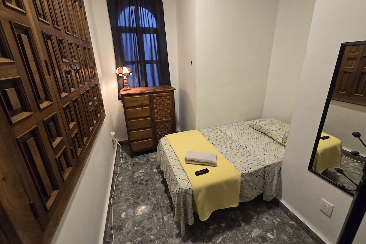 Economy Room | Blackout drapes, iron/ironing board (on request), WiFi (free)