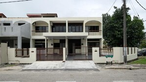 A two-story building with a gated entrance, a covered walkway, and a sign indicating the name "KARIBAL". - CLP Home near Sri Muniswarar Temple 2 (Perai)
