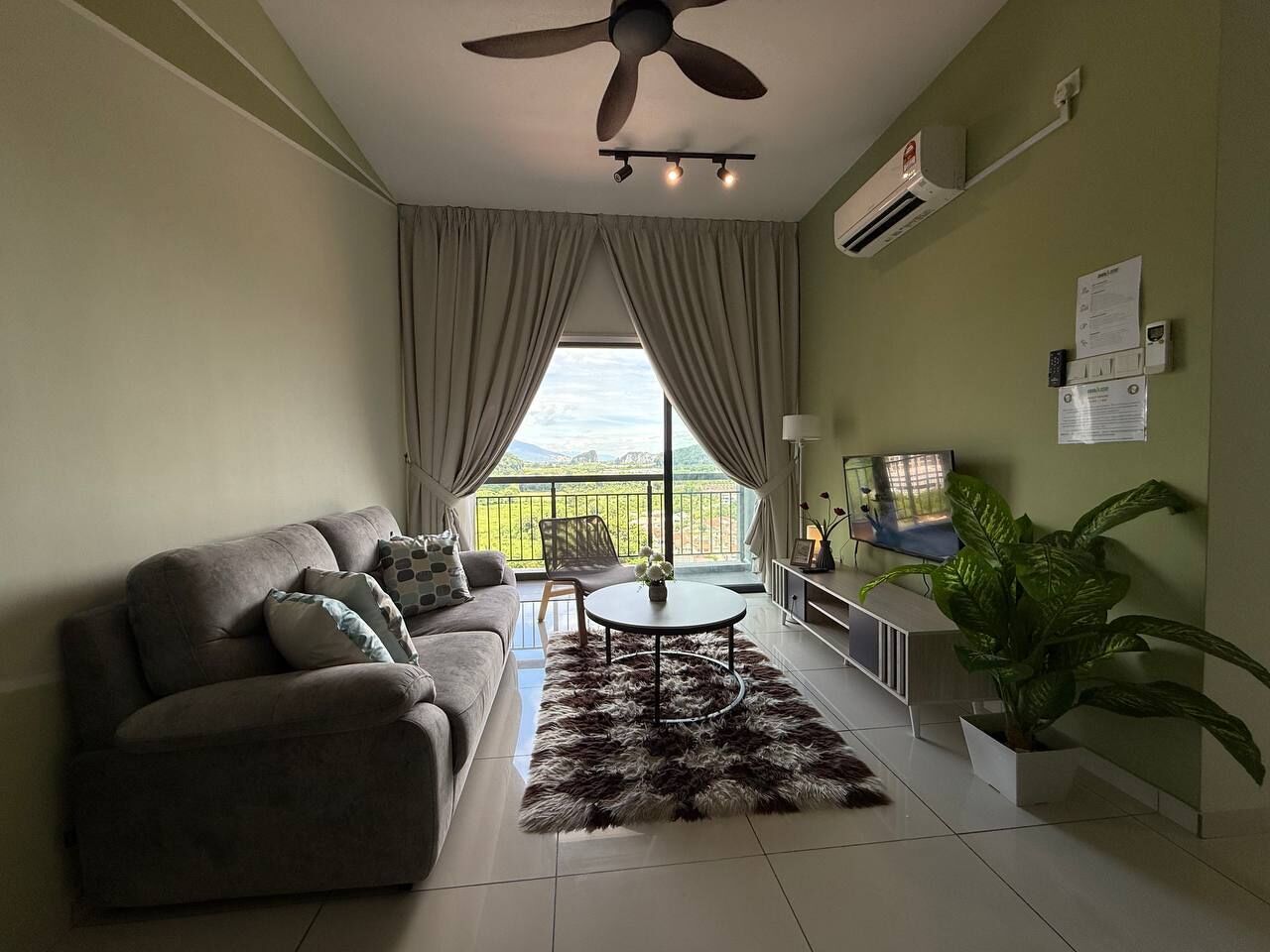 Comfort Apartment | Living area | 24-inch Smart TV with digital channels