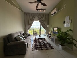 Comfort Apartment | Living area | 24-inch Smart TV with digital channels