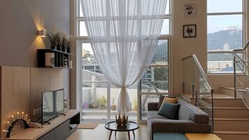 Duplex | Living room | 32-inch LCD TV with satellite channels