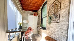 A compact kitchen with a wooden ceiling, a white door, and a window with a view. - Historic Downtown Luxury-Lake-Coffee-Spa like BA (Delafield)