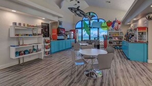 A children's play area with a pool table, seating, and various toys and decorations. - Las Palmas 1644 Pools Waterpark Resort (St. George)