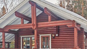 A log cabin with a porch, two windows, and a number '9' sign. - Rustholli 9 by Interhome (Tampere)