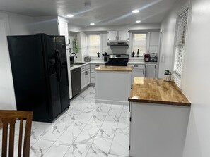 Fridge, microwave, oven, stovetop - Charming 4-bedroom home in trendy Benson District in Omaha.  (Omaha)