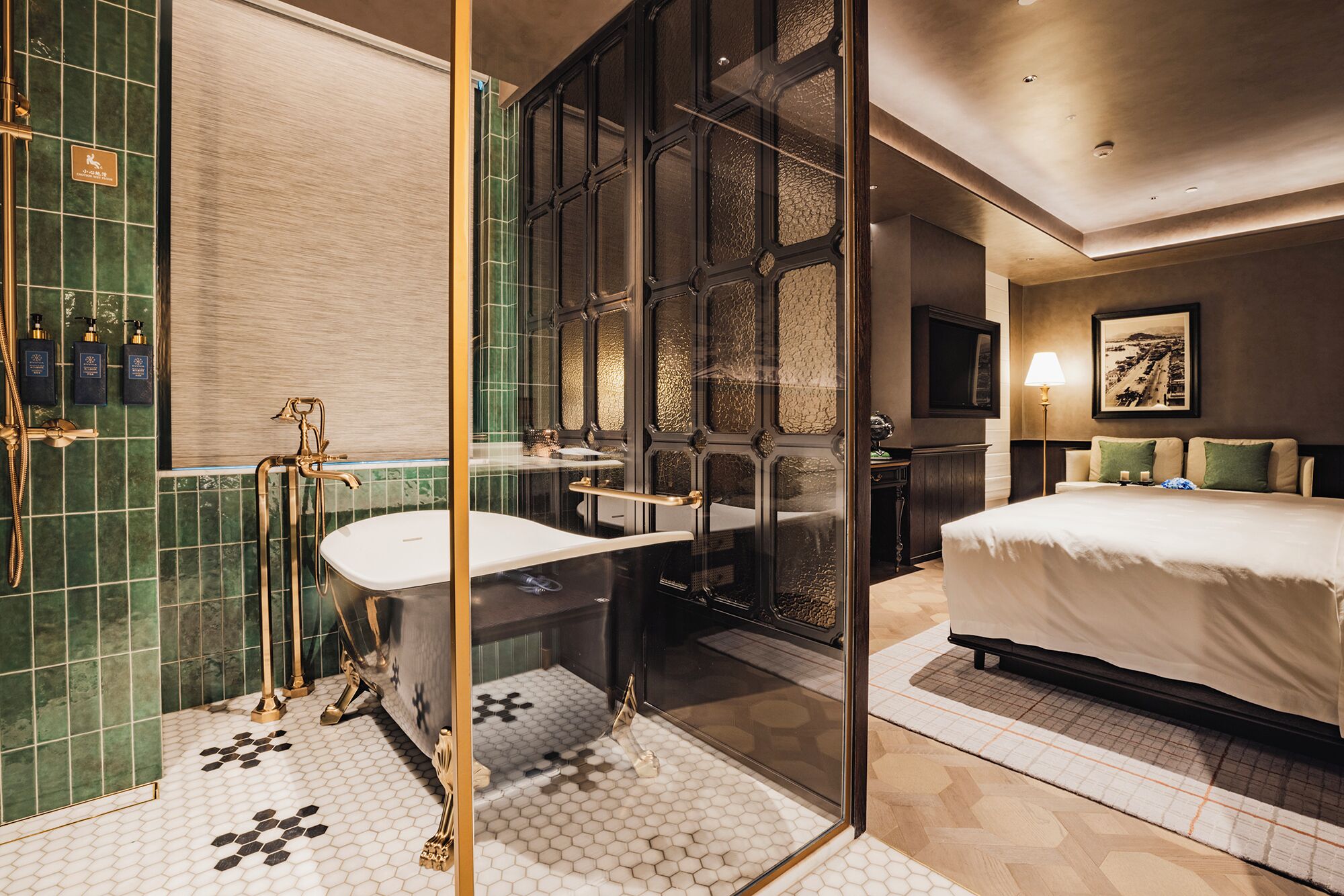 A modern bathroom with a glass-enclosed shower, a bathtub, and a vanity with a sink.