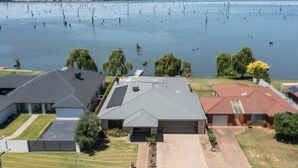 A residential area with houses, a large body of water, and a clear sky. - The Rosemary Lakehouse - Spring Offer (Yarrawonga)