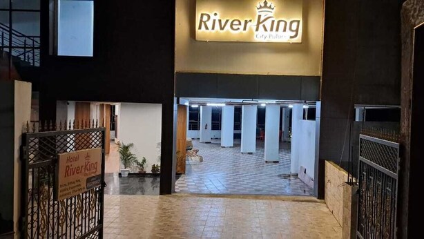 The entrance to River King City Palace with a tiled floor and a sign above the door. - River King City Palace (Guwahati)