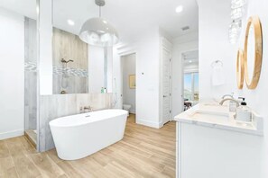 Shower, hair dryer, towels, shampoo