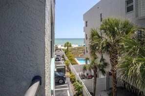 Enjoy breathtaking ocean views from this beachfront property's spacious balcony.