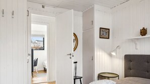 A bedroom with a large bed, a bedside table, a lamp, and a picture on the wall. - "Josef" - 1.4km from the sea by Interhome (Nykøbing Sj)