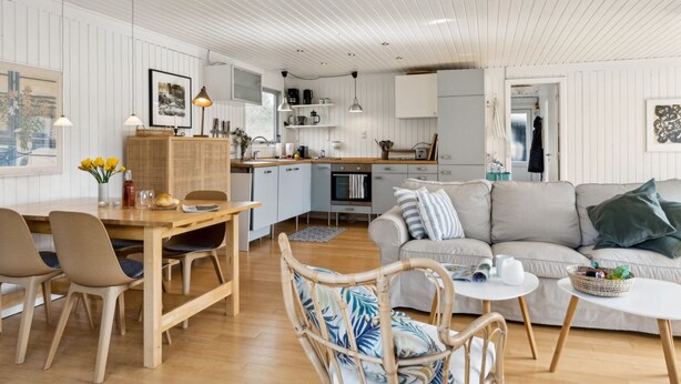 A modern, open-plan living space with a kitchen, dining area, and seating area. - "Josef" - 1.4km from the sea by Interhome (Nykøbing Sj)