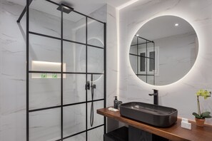 Shower, eco-friendly toiletries, hair dryer, towels