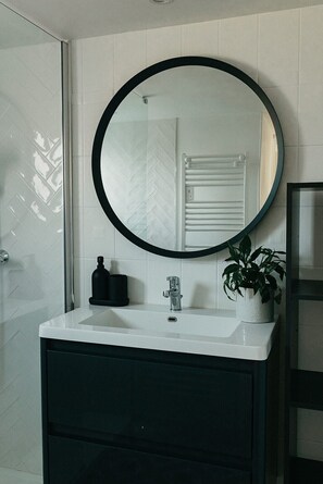 Shower, eco-friendly toiletries, hair dryer, towels