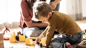 A child playing with toys on a wooden floor. - HUUS123, Apartment 3 (Au)