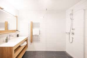 Shower, hair dryer, towels, toilet paper